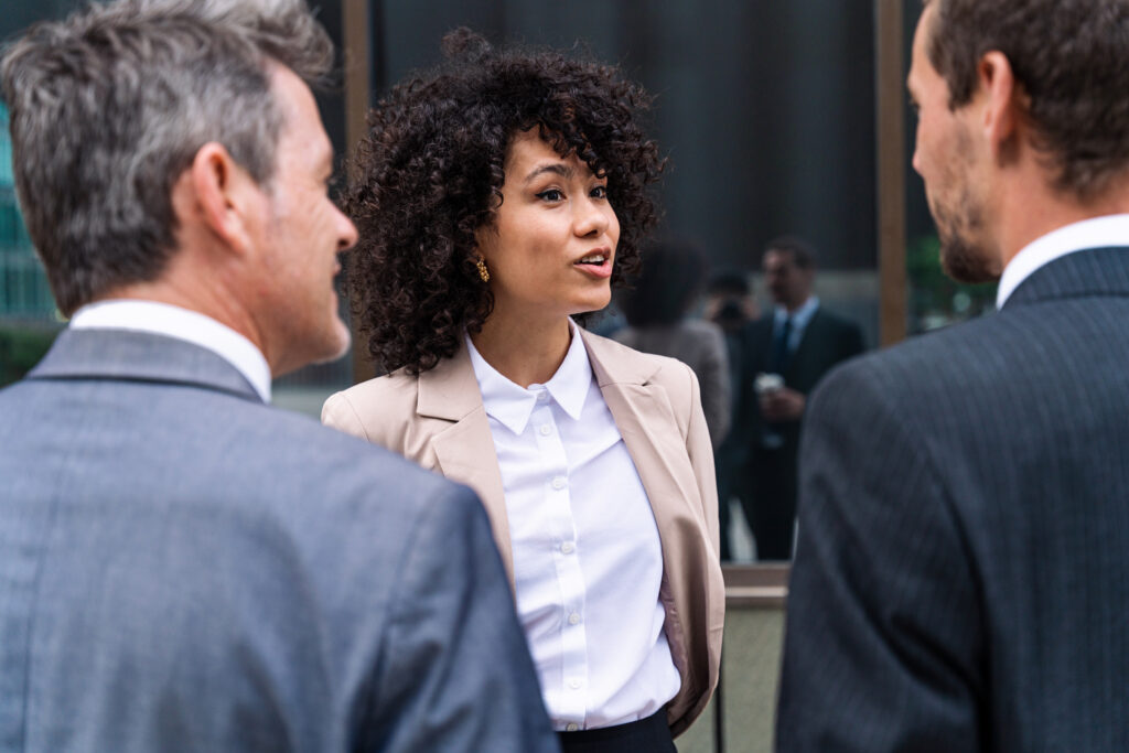 A woman prepared to do an interview with people outside