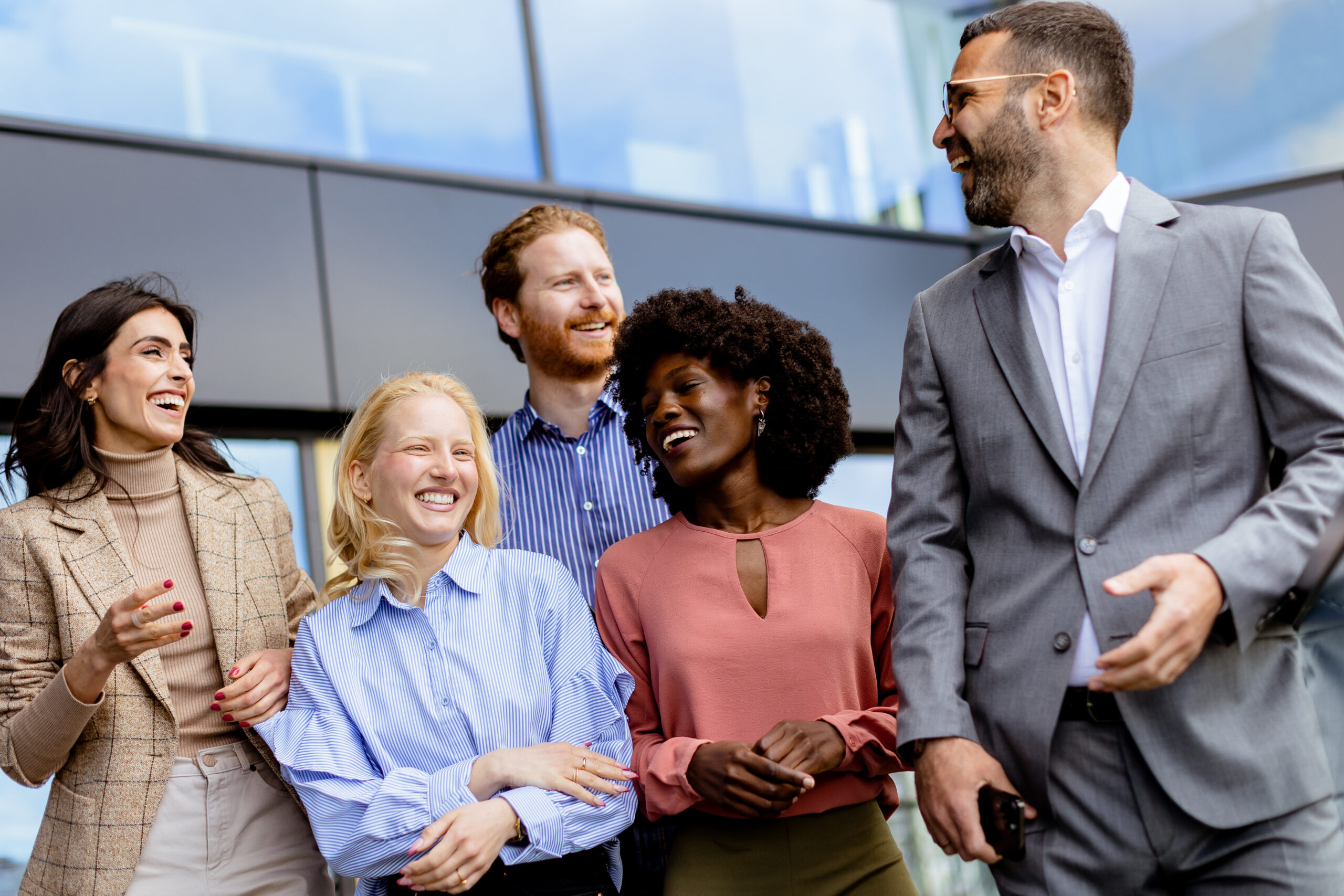 Sales and marketing professionals connecting outside